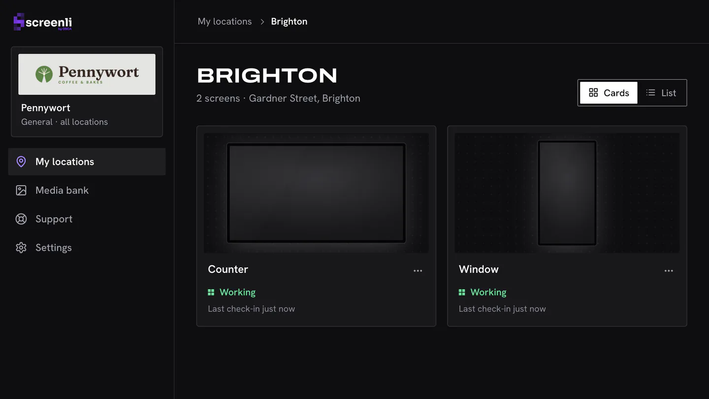 The Screenli dashboard showing a cafe’s Brighton branch: a counter screen and a window screen, both marked as working