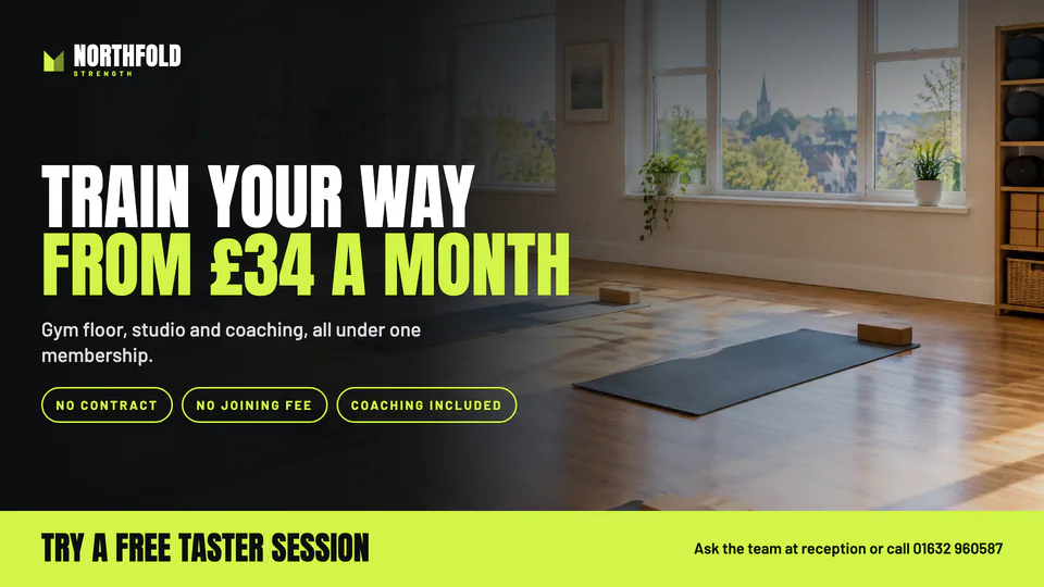 Widescreen gym screen promoting membership and a free taster session